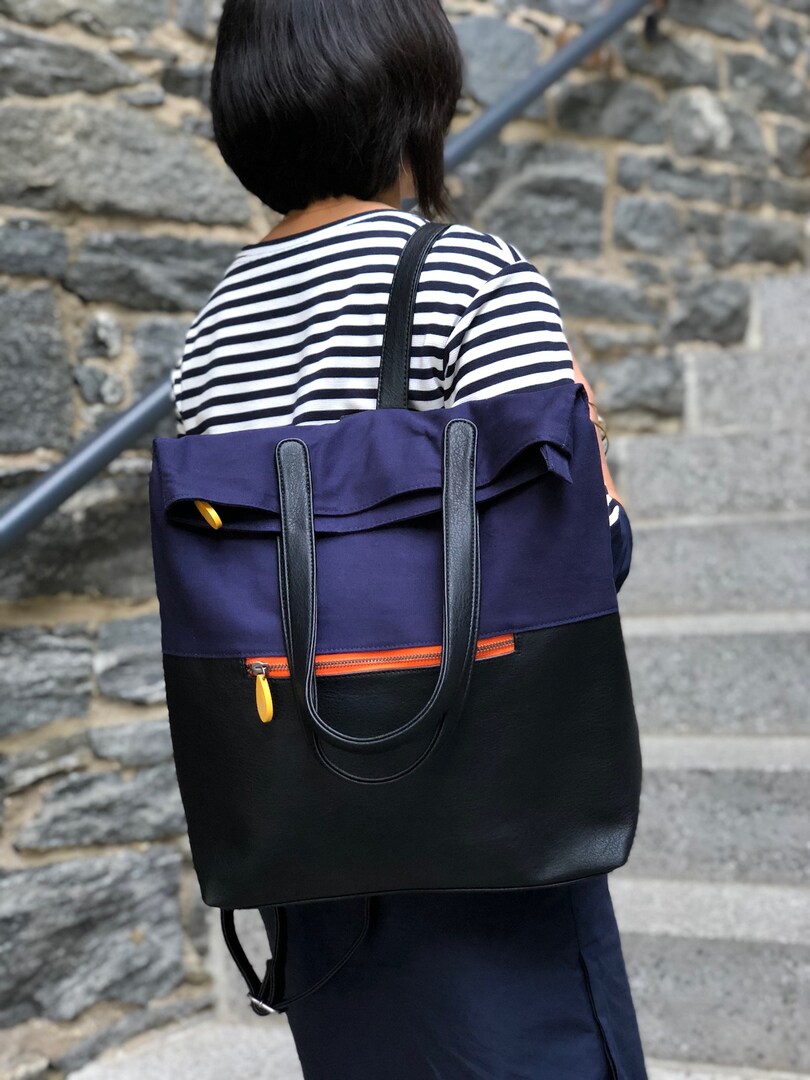 Convertible backpack purse and laptop bag with trolley sleeve by Canopy Verde | MakerPlace by Michaels Convertible backpack purse and laptop bag with trolley sleeve by Canopy Verde | MakerPlace by Michaels